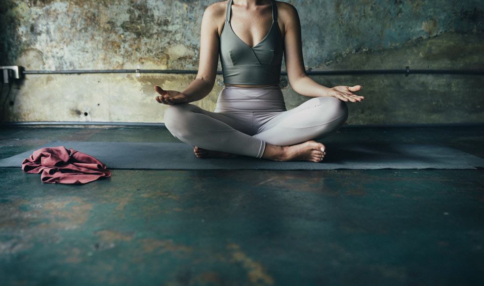Woman meditating at home