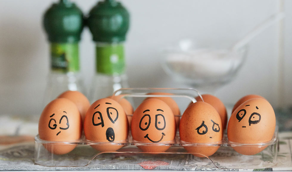 Painted eggs expressing a range of emotions from joy to sadness